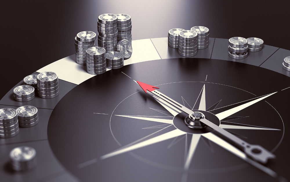 Compass over black background with needle pointing the biggest pile of money Concept of making profits and good investment advice or wealth management. 3D illustration.