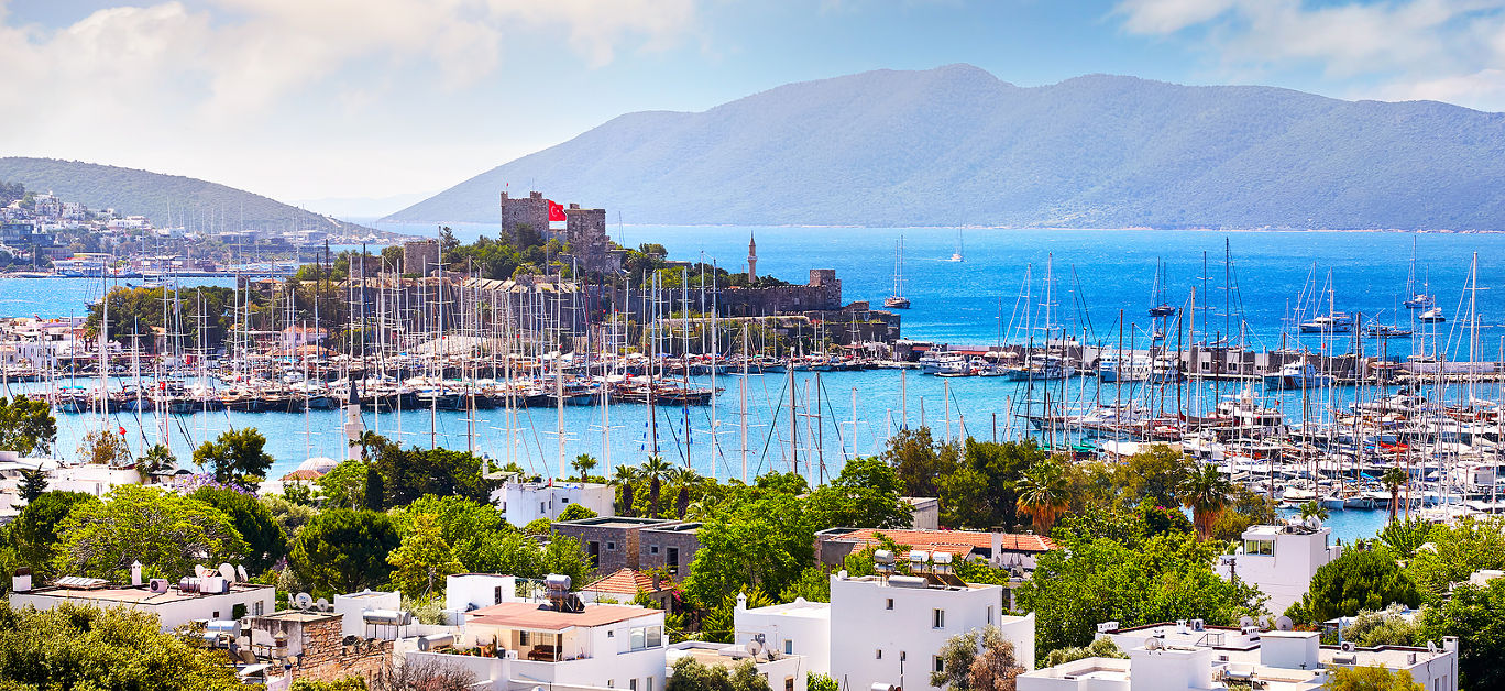 View of Bodrum castle and Marina Harbor in Aegean sea in Turkey