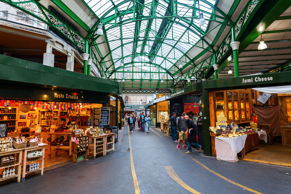 Borough Market with unidentified people in Southwark Central London. It is is a wholesale and retail food market one of the largest and oldest in London
