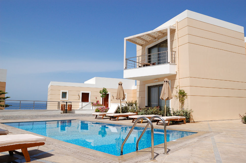 Swimming pool at the modern luxury villa Crete Greece