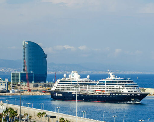 View of port Vell and its cruise terminal with cruise-liner Azamara and W Barcelona also known as the Hotel Vela (Sail Hotel).