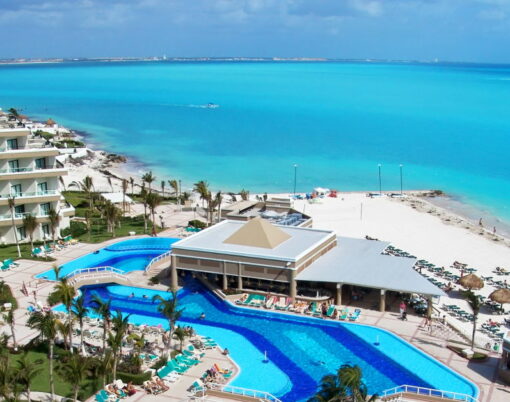 Luxurious hotel with a swimming pool at Cancun Mexico. Perfect tropical vacation. Caribbean Sea.