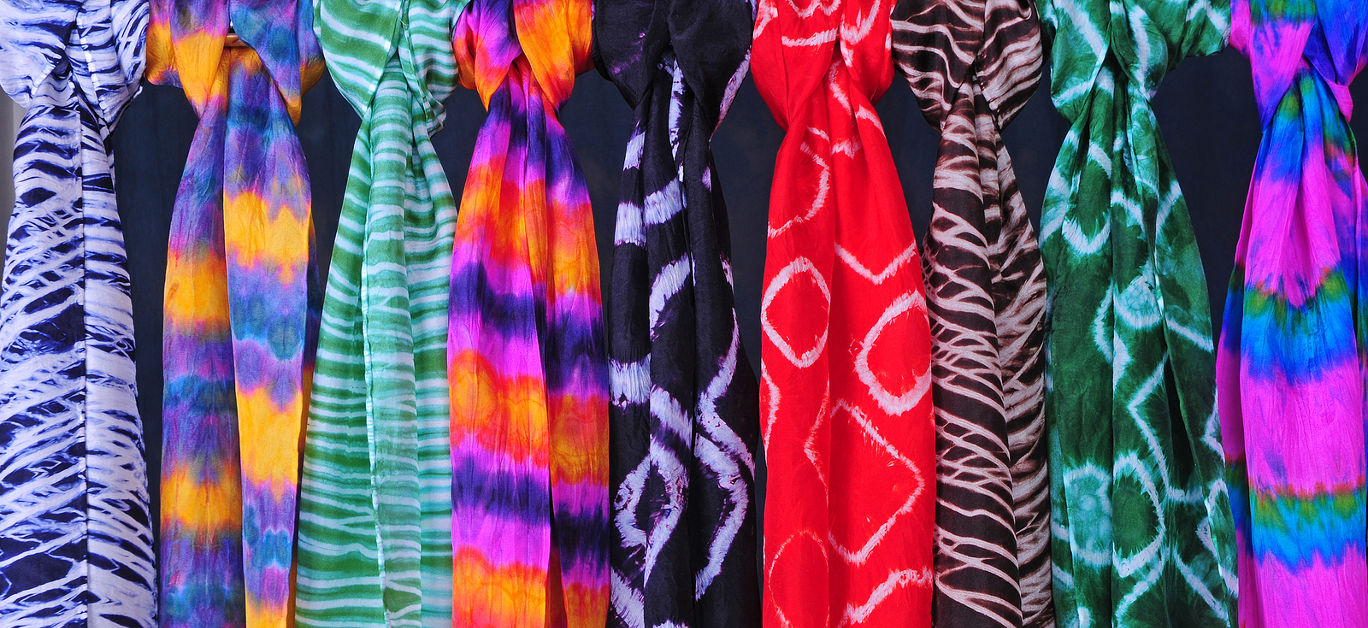 Hand-dyed silk scarves using various Japanese shibori methods.