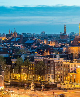 Amsterdam skyline in historical area at night Amsterdam Netherlands. Ariel view of Amsterdam Netherlands.