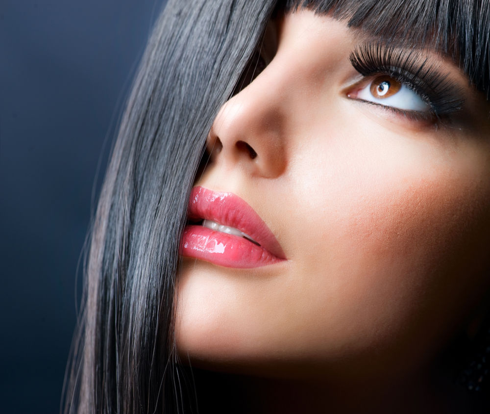 Fashion Brunette . Beautiful Makeup and Healthy Black Hair