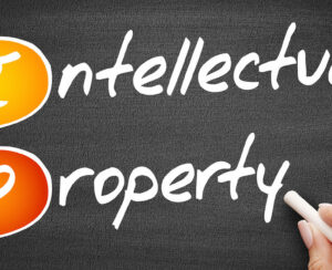 IP - Intellectual Property, business concept on blackboard