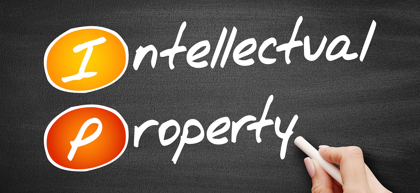 IP - Intellectual Property, business concept on blackboard