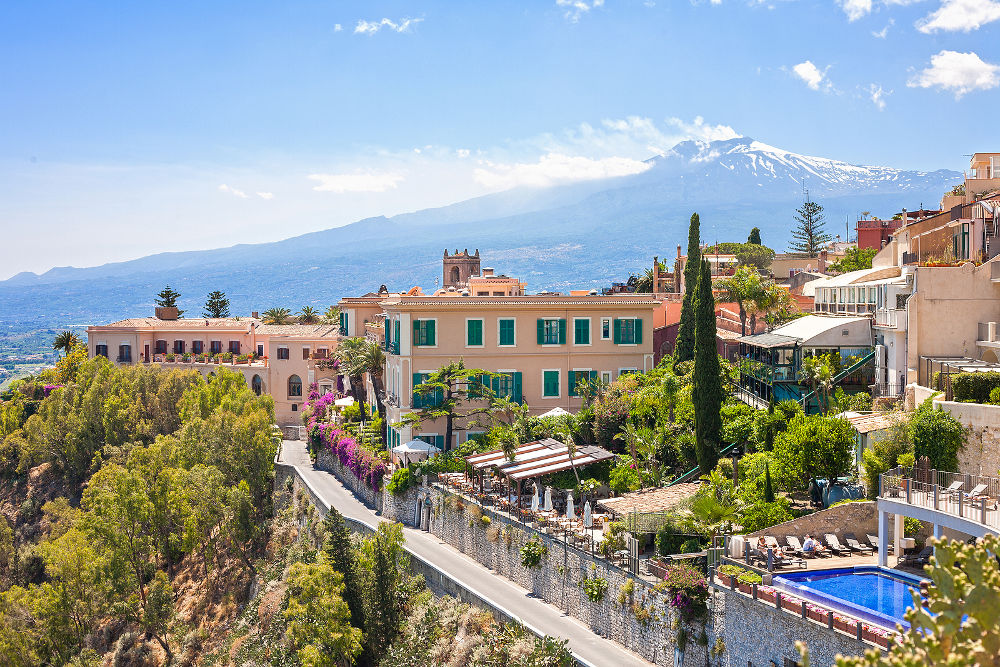 View of Taormina with Etna volcano int the back in Sicily Italy