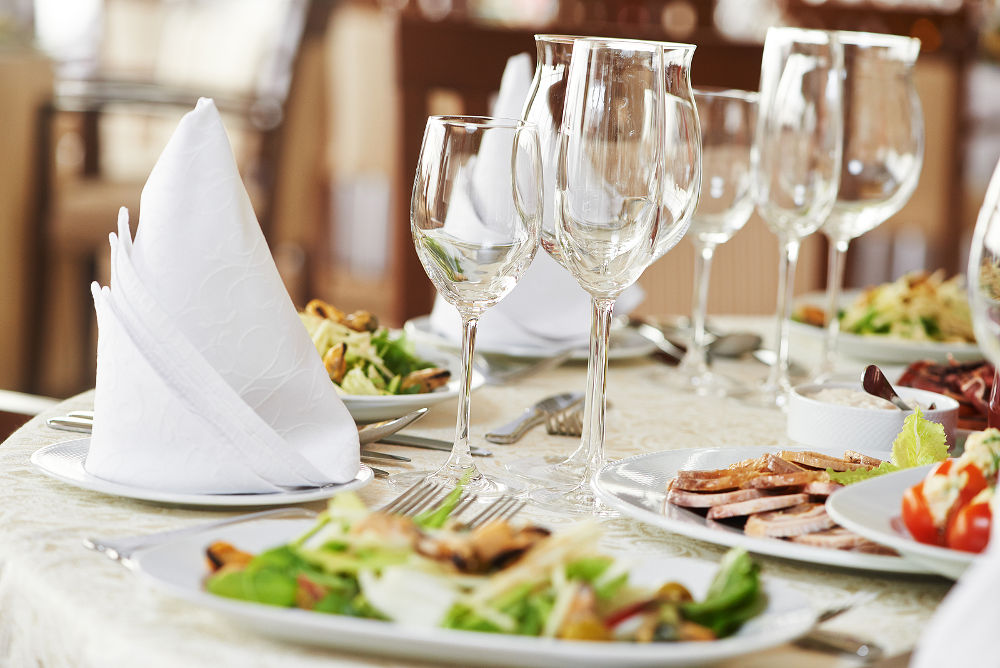 catering services background with snacks and glasses of wine on bartender counter in restaurant