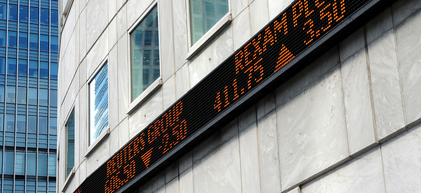Financial market tickertape board outside city of London building