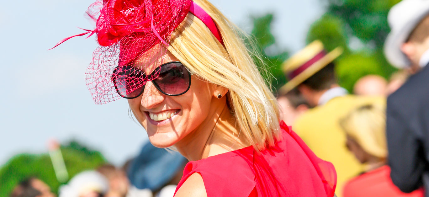 Lovely smiling woman with a pretty hat at the Prix de Diane The Prix de Diane is a French horse race which runs every year in June.
