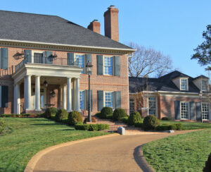 View from driveway of a luxury brick home.