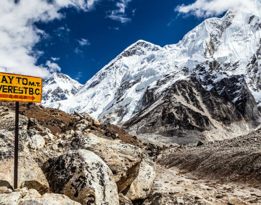 Footpath to Mount Everest Base Camp signpost in Himalayas Nepal. Khumbu glacier and valley snow on mountain peaks beautiful view landscape